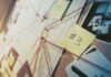 Investigation board with photos, notes, and red string.