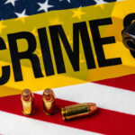Six Relatives Dead — Police Stunned A gun and bullets on an American flag with a crime scene marker