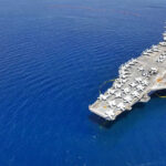 Watchdog Probes Lethal Boat Strikes Aircraft carrier on a vast blue ocean