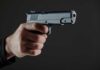 VIDEO: Wanted Gunman Roams — Bloodshed Follows Hand holding a semi-automatic pistol pointed forward