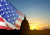 War Powers Showdown Stuns Conservatives Capitol building silhouette with American flag at sunrise.