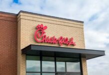 Chick-fil-A restaurant sign on a brick building