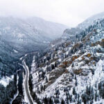 Desolation Wilderness Swallows Hiker Snowy valley with road winding through frozen forest