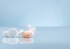 RECALL: Pills That Don’t Work? Assorted pills on a reflective surface against a light background