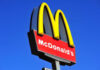 Ambush at McDonald’s Leaves Manager Severely Hurt McDonalds logo on a pole clear sky