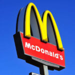 Ambush at McDonald’s Leaves Manager Severely Hurt McDonalds logo on a pole clear sky