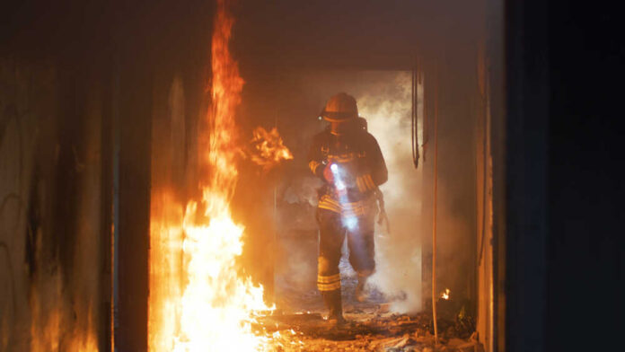 Fireman,Examining,Burning,Corridor,During,Rescue,Mission