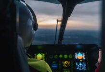 Pilot's view from a helicopter cockpit during sunset