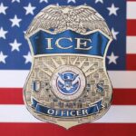 ICE Moves First In Toddler Killing ICE officer badge displayed against an American flag background