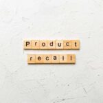 Label Fail Sparks Multi-State Cookie Recall Wooden letter tiles forming words on a white textured surface