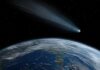 NASA’s $10B Scope Finds Baby Saturn A comet streaking through space above Earth