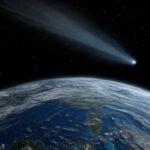 NASA’s $10B Scope Finds Baby Saturn A comet streaking through space above Earth