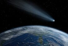 NASA’s $10B Scope Finds Baby Saturn A comet streaking through space above Earth