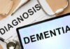 One Vial Predicts Dementia Decades Early Medical diagnosis paperwork and a tablet displaying the word Dementia
