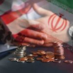 Iran War Destroying THESE U.S. Farms A hand resting on a table with coins stacked in front, overlaid with flags of the US and Iran