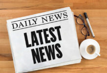 Six Flags’ Monster — But Verified? Newspaper with headline latest news on table