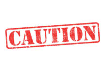 Parasite Lettuce Hits 41 States Red caution sign with grunge texture diagonal
