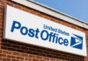 USPS Becomes Election Gatekeeper? United States Post Office sign on a brick building
