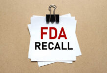 Walmart Soup Triggers 29-State Scare A notice labeled 'FDA RECALL' clipped to white papers on a brown background
