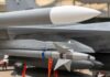 Missile Cupboards Go Bare? Missile mounted under a fighter jet wing