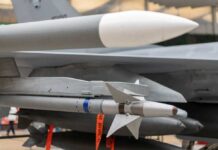 Missile Cupboards Go Bare? Missile mounted under a fighter jet wing