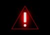 Water Blackouts Hit San Juan Red warning triangle with exclamation mark on black background