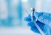 Hospital Mix-Up Leaves Patients Paralyzed A gloved hand holding a syringe and a vial of liquid
