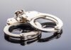 Congress Scandal Erupts — Bombshell Arrest Close-up of metallic handcuffs on a reflective surface
