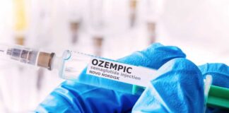 Gloved hands holding a syringe labeled Ozempic