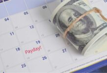 Masked Donor Triggers Urban Gold Rush A rolled bundle of cash placed on a calendar marked with 'Payday!'