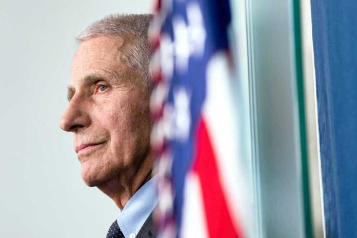 Anthony Fauci close-up with flag.