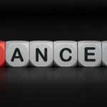 Rare Cancer Steals Rising Influencer Blocks spelling the word 'CANCER' with one block in red