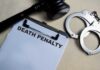CONDEMNED — Death Verdict Just Delivered Clipboard with death penalty document beside gavel and handcuffs