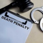CONDEMNED — Death Verdict Just Delivered Clipboard with death penalty document beside gavel and handcuffs