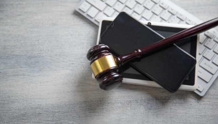 Judge,Gavel,With,A,Phone,,Tablet,,Computer,Keyboard.