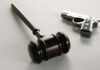 Judge Guts 1930s Gun Rules wooden judge's gavel with a handgun in the background