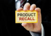 Safety Meltdown In Back Seat Hand holding a product recall card