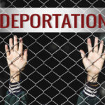 Bold Deportation Gambit Hits Liberia Hands reaching through a chain-link fence with the word 'DEPORTATION' above