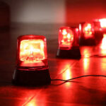 BLAST Kills Americans At Tourist Favorite Red emergency lights on dark floor, illuminating the area.