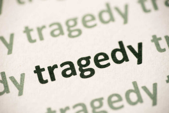 Word,Tragedy,Printed,On,White,Paper,Macro Close-up of the word 'tragedy' printed multiple times in varying shades