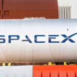 Elon’s Starship Blitz Targets Gulf Wetlands Large silver cylindrical tank with a blue logo