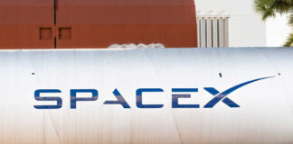 Large silver cylindrical tank with a blue logo