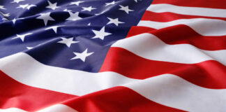American flag with stars and stripes in close-up