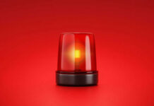 TRAVEL ALERT: Threat Intel Halts Night Moves Red emergency light on red background