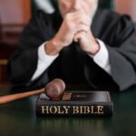 Supreme Court Slaps Down Death Penalty Judge A judge in a courtroom with a gavel and a Holy Bible on the table