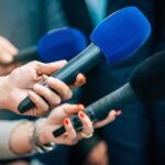 Establishment Landslide Shocks The Squad Reporters holding colorful microphones
