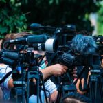 Congressman Vanishes — Then Drops One Word TV news cameras crowding together at an outdoor event