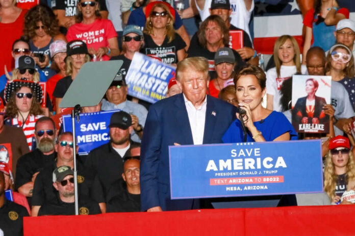 Donald Trump at a rally with a woman speaking at the podium; Alexandros Papadiamantis, Margarita Stolbizer, and David Lowy are present in the crowd