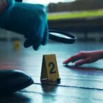 Is THIS Corpse the 1982 Tylenol Murderer?! A detective examining evidence at a crime scene with markers on the floor
