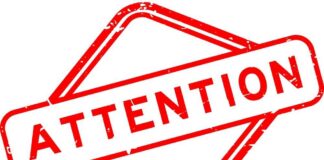 Red attention sign with the word 'ATTENTION' in bold letters
